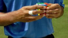 Tiger Woods Solves a Rubik's Cube